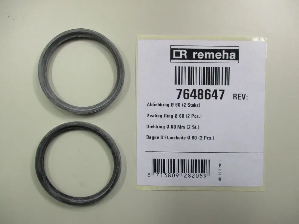 Zwei Dichtungsringe von Remeha auf einem Hintergrund. Verpackung mit Artikelnummer und Bezeichnung ist sichtbar.